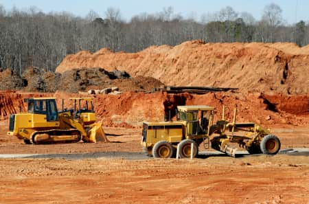 Heavy construction equipment on a job site