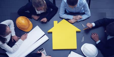 Group of contractors around a table discussing business