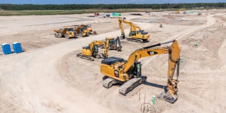 Fleet of CAT equipment (excavator, dump trucks)