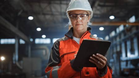 Woman in construction using an iPad