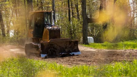 Komatsu 39EX bulldozer operating on a roadwork project