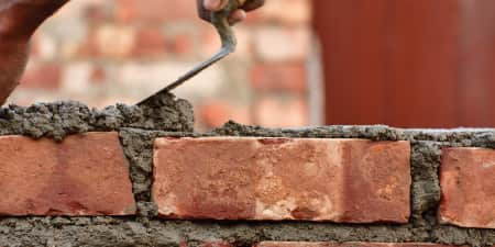 Worker bricklaying