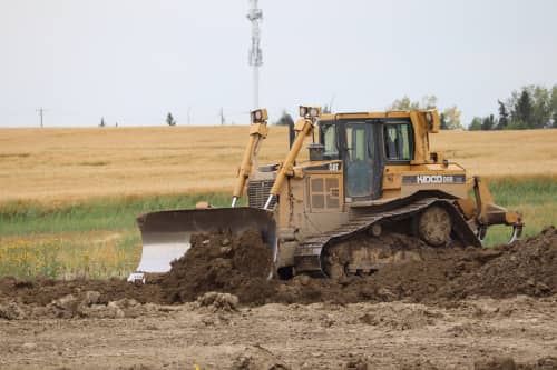 dozer pushing dirt on a construction site