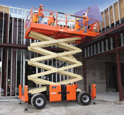 JLG Scissor lift with a large work platform and many construction workers on it