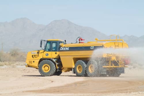 Rock truck with a water tank attachment