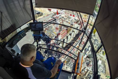 Over shoulder view of a tower crane operator