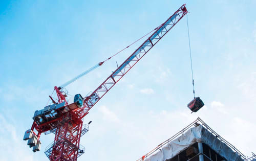 Tower crane moving a load