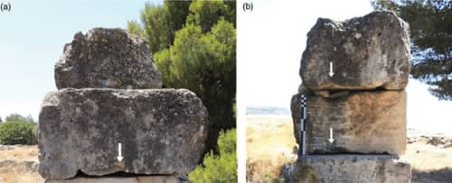 old stones with markings of cranes