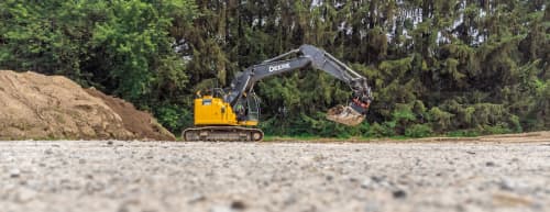 John Deere Excavator rental driving on a construction site