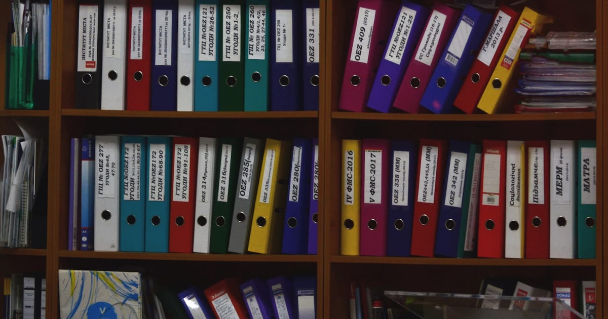 Shelves filled with organized document binders