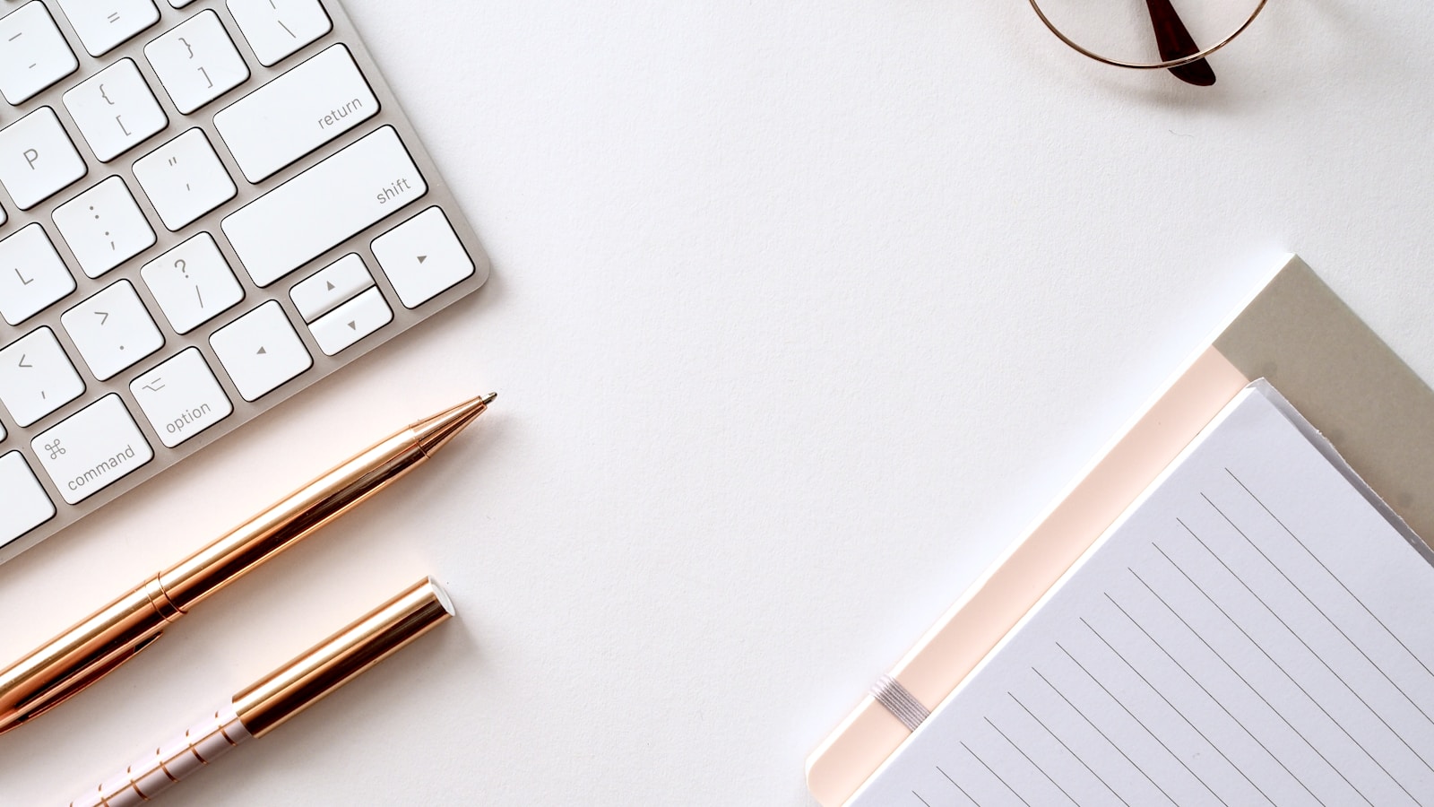 Notebook and keyboard representing pay-once note apps Flow and UpNote