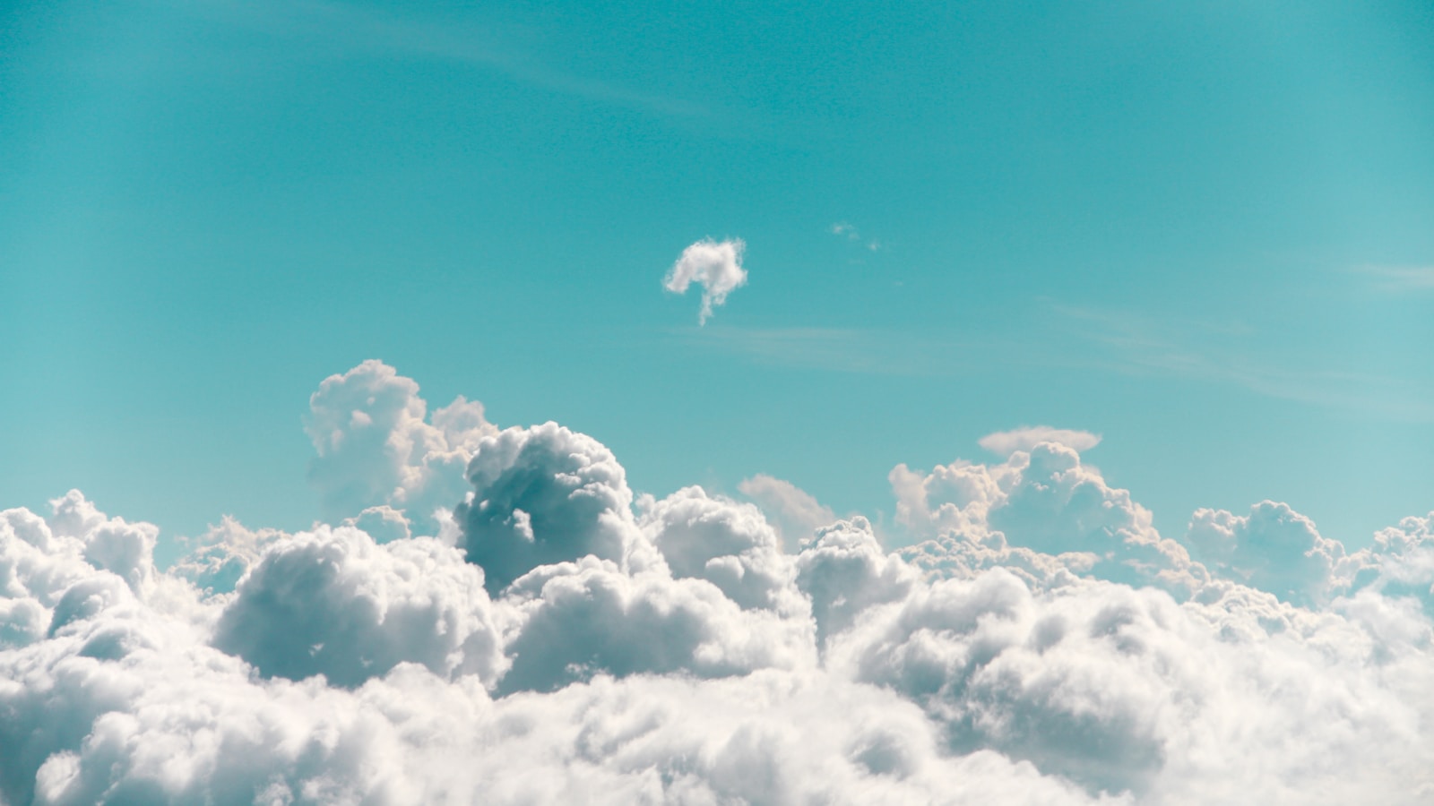 Clouds viewed from above against a blue sky
