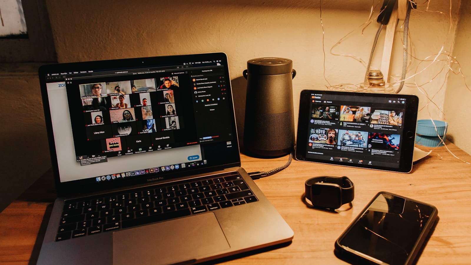 Laptop, tablet, phone, and camera arranged for connected work