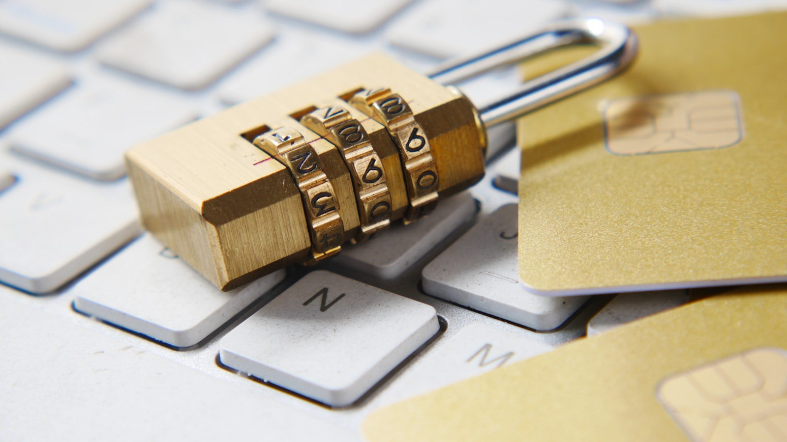 Combination padlock resting on a computer keyboard for Anytype privacy and encryption