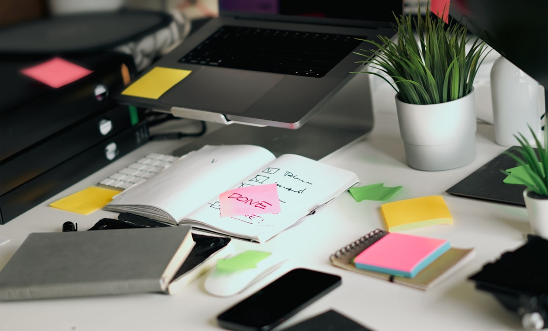 Cluttered desk with many apps and tabs versus one clean notebook for migrating from Notion