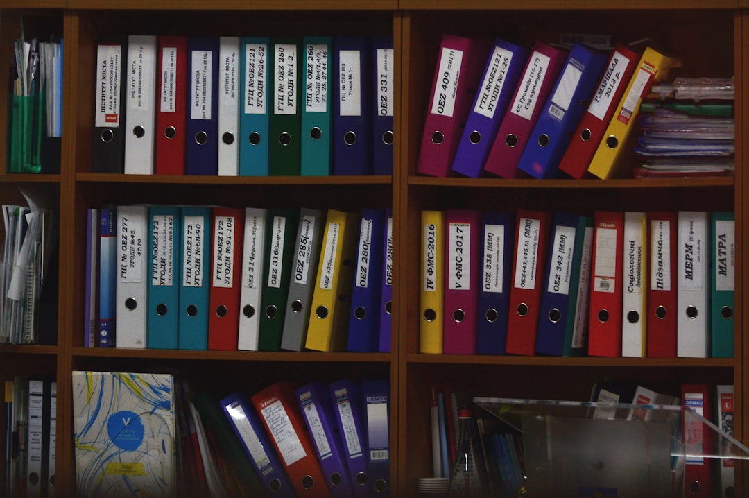 Organized shelf of labeled binders and notebooks for no-subscription productivity tools