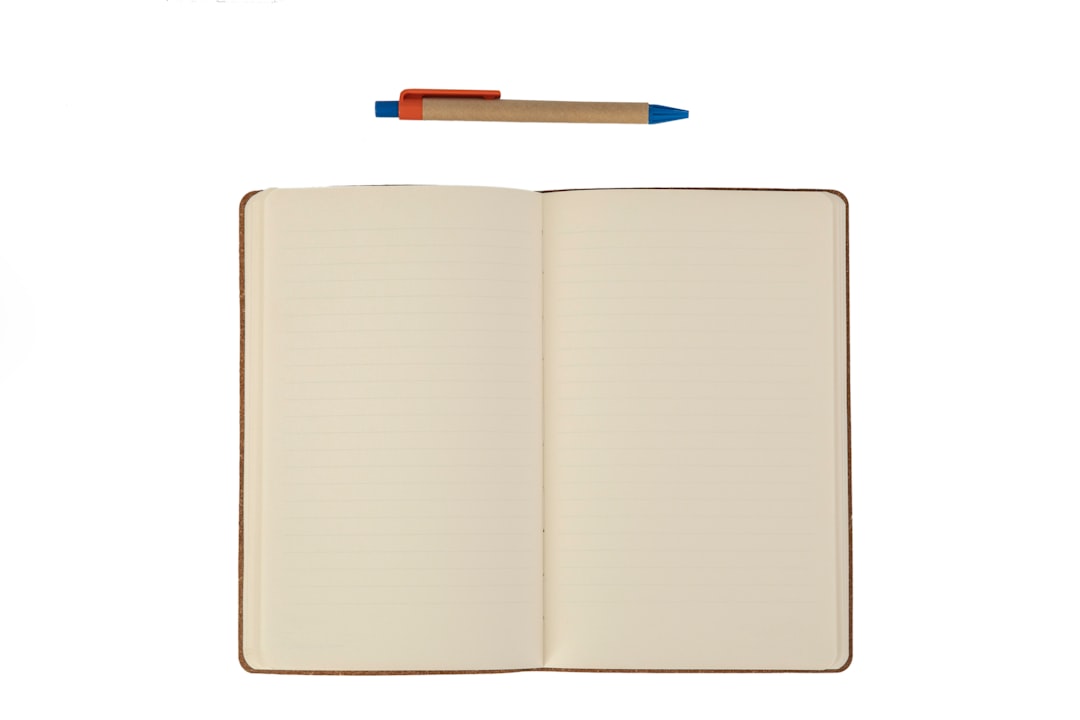 Open notebook with handwritten notes beside a pen on a wooden desk, representing stored project context an AI can read through MCP