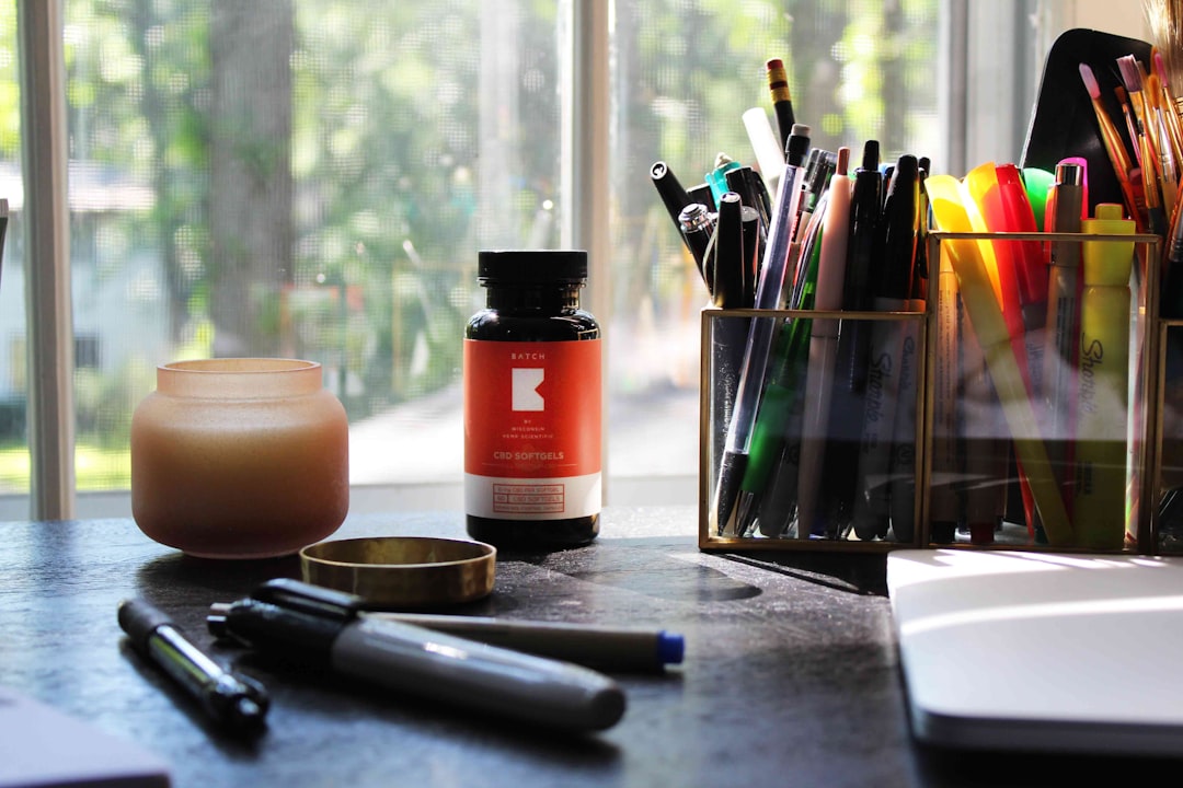 Cluttered desk with scattered notebooks and sticky notes, representing a note app that grew heavy and disorganized