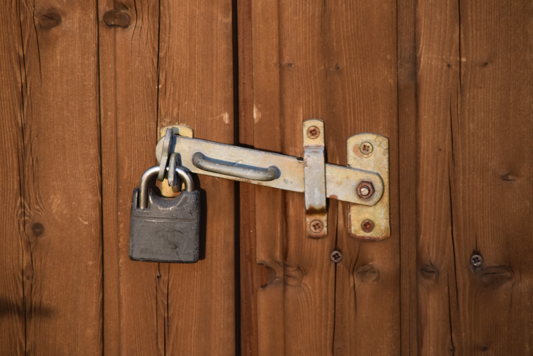 A brass padlock latched onto a weathered wooden door, representing the access control decision behind connecting an AI tool to your data