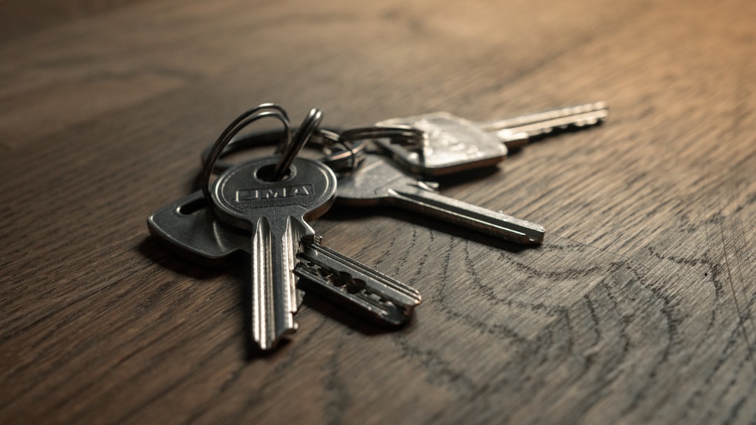 A set of keys resting on a wooden table