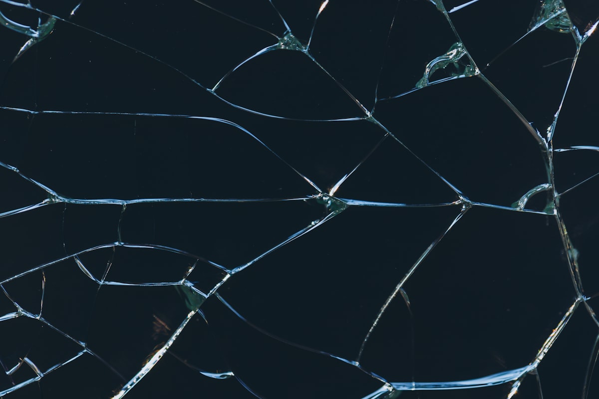 A cracked pane of glass in a window