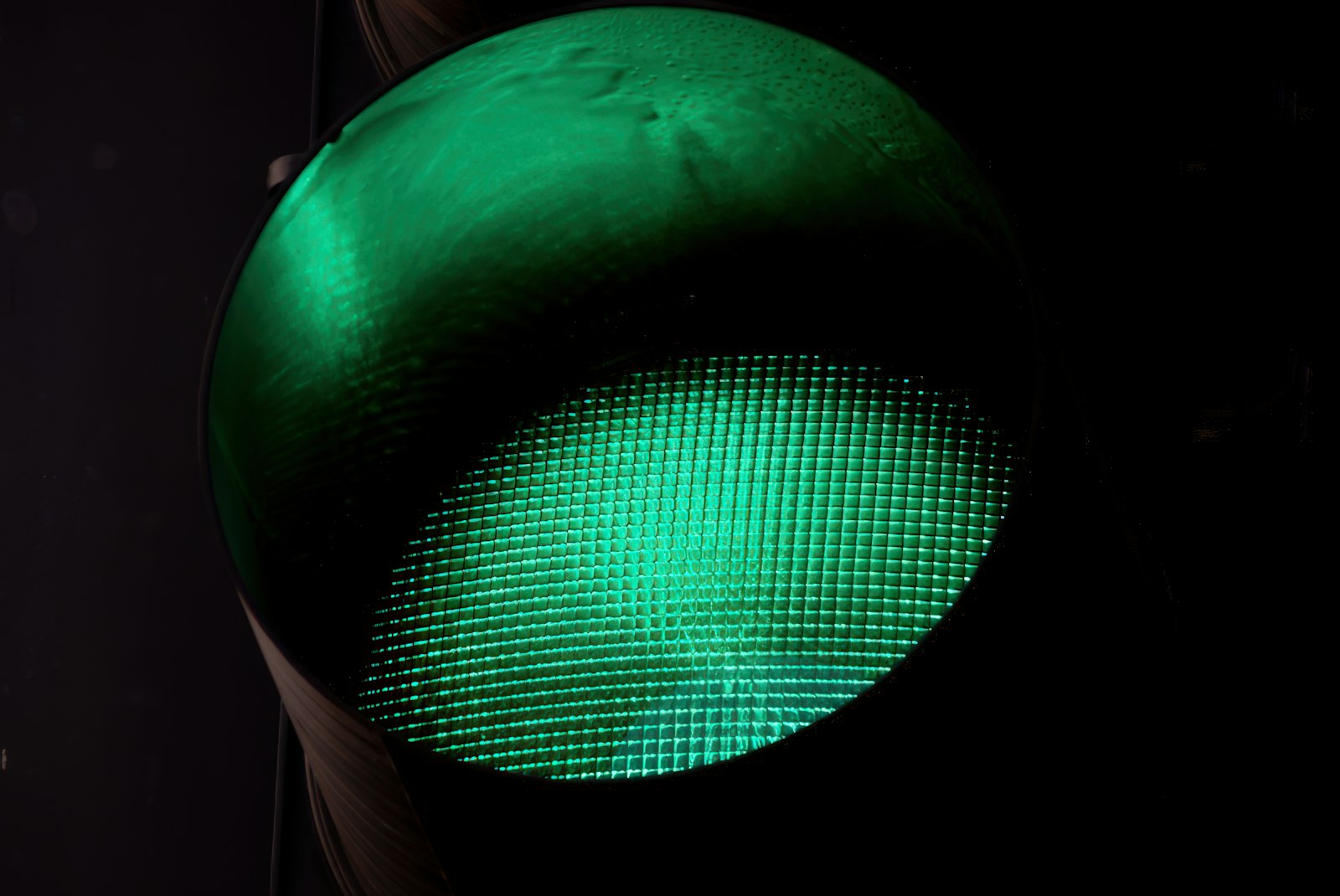 A traffic signal showing a green light in close-up