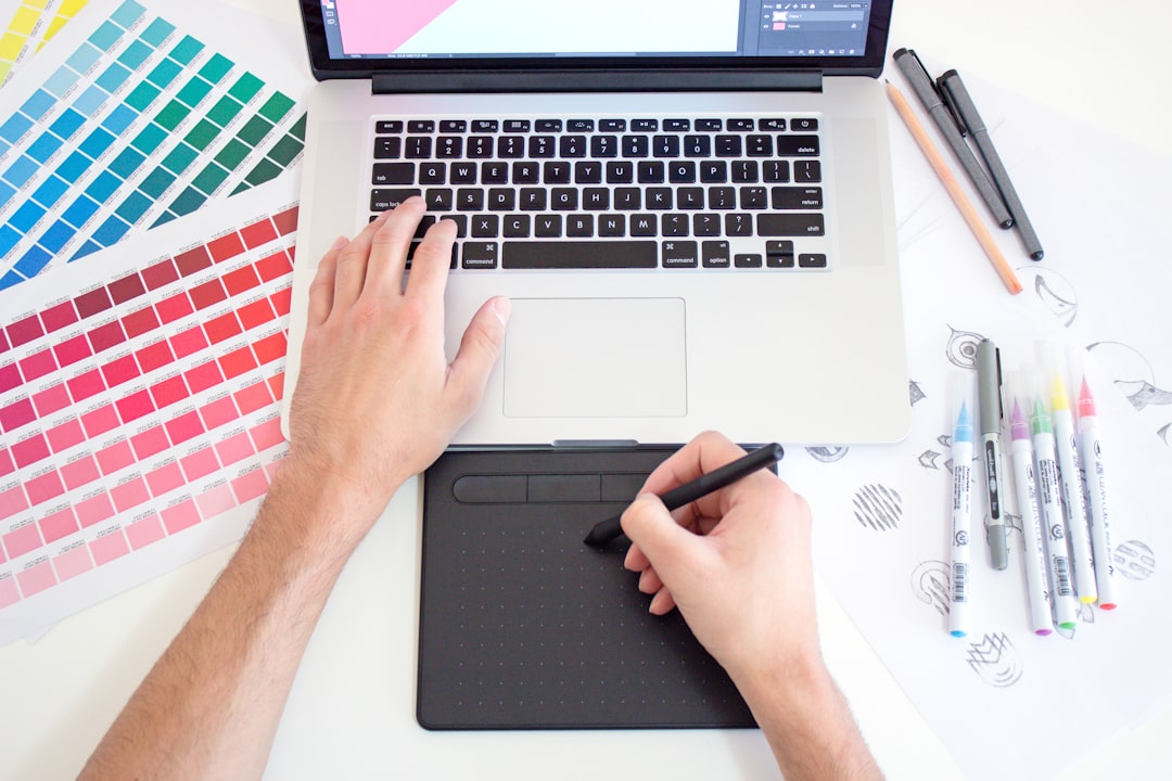 A designer sketching on a tablet with a stylus, representing deliberate visual layout work