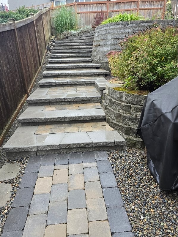 Stone steps and retaining wall with plants at Todd's Nursery in Puyallup, WA
