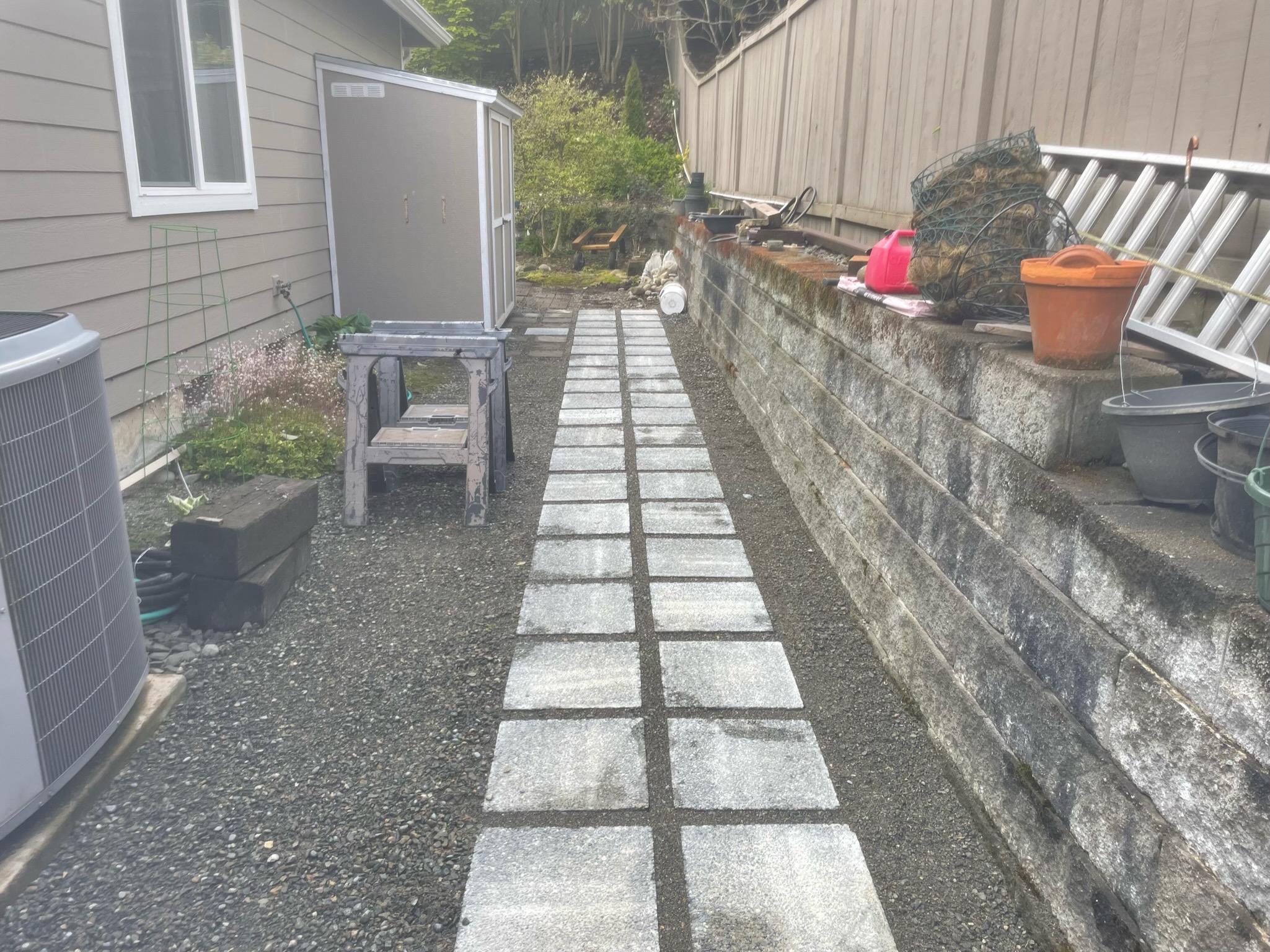 Modern patio with concrete pavers and retaining wall by Todd's Nursery in Puyallup, WA