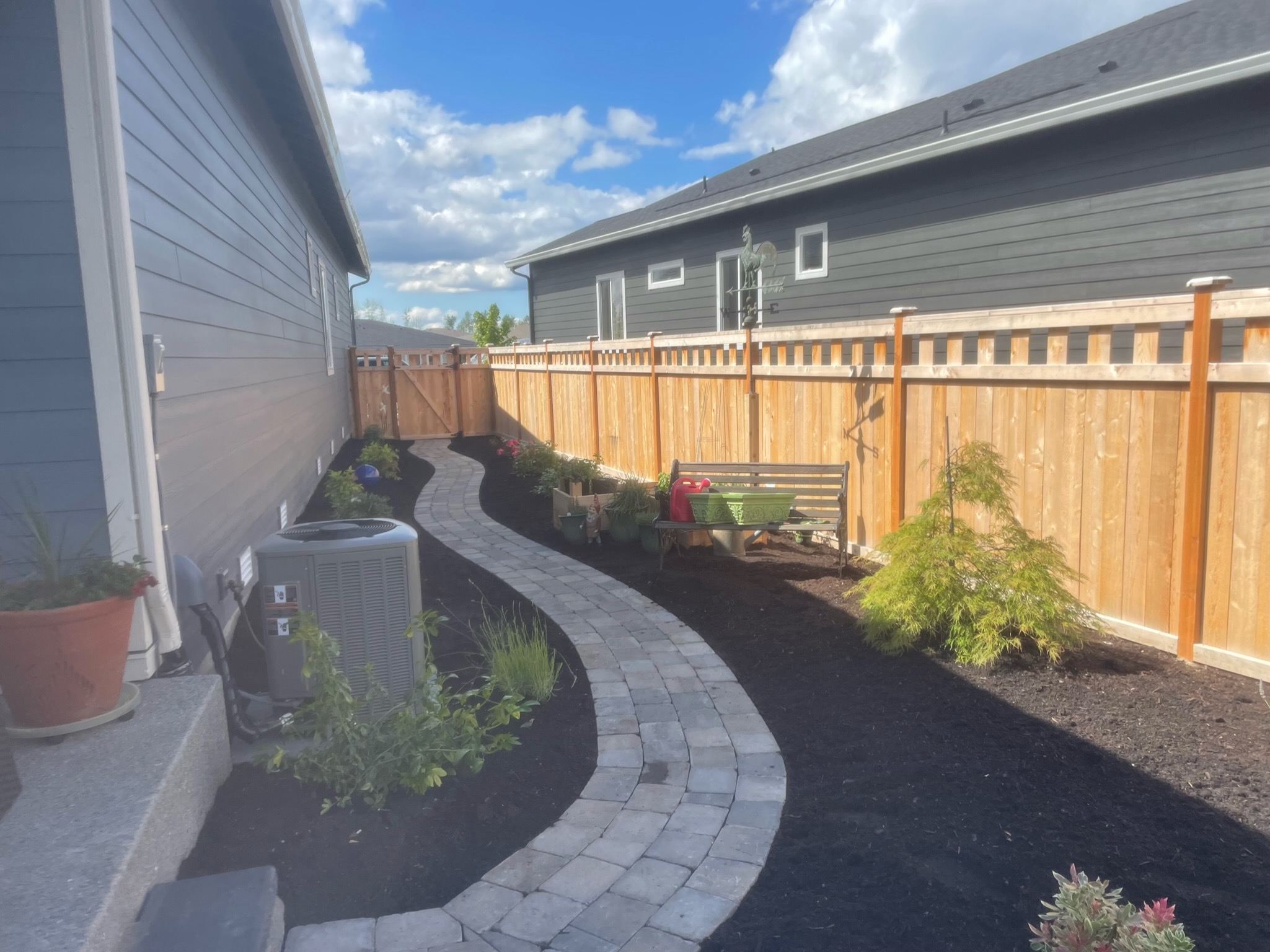 Curved stone pathway with plantings at Todd's Nursery in Puyallup, WA
