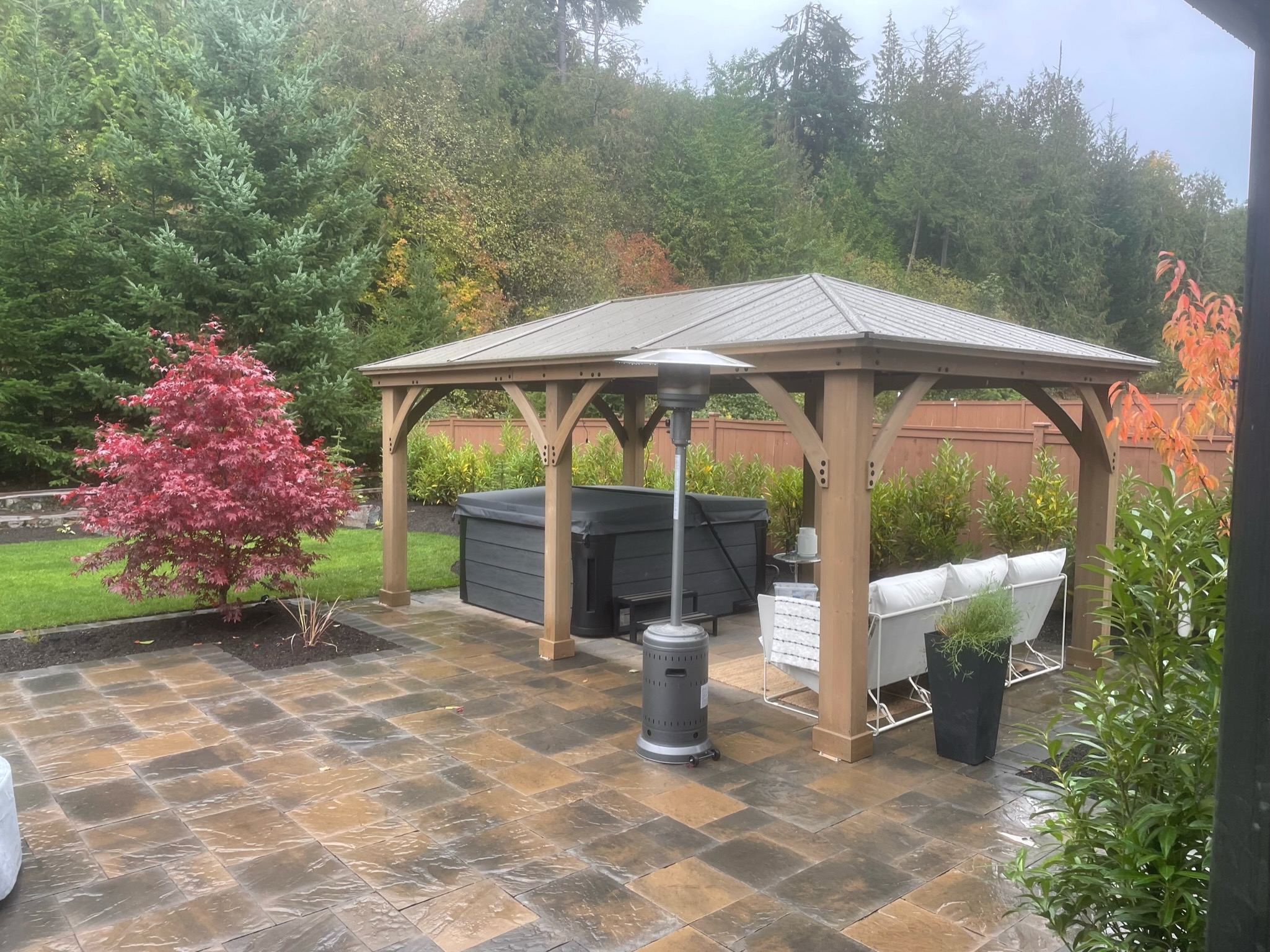 Patio with gazebo, Japanese maple, and seating at Todd's Nursery in Puyallup, WA