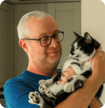 Pet owner with their cat