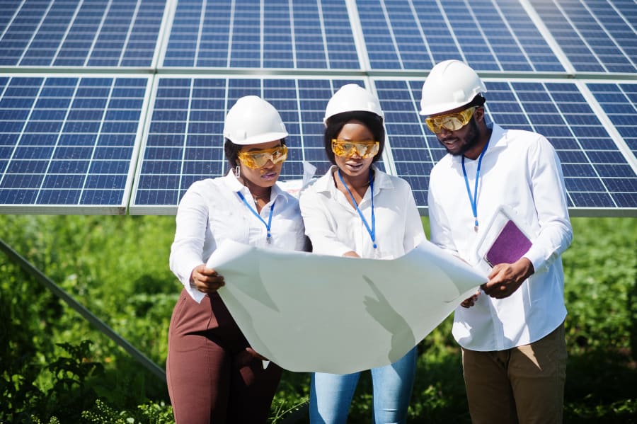 Origin Volt Electric technicians inspecting solar panels