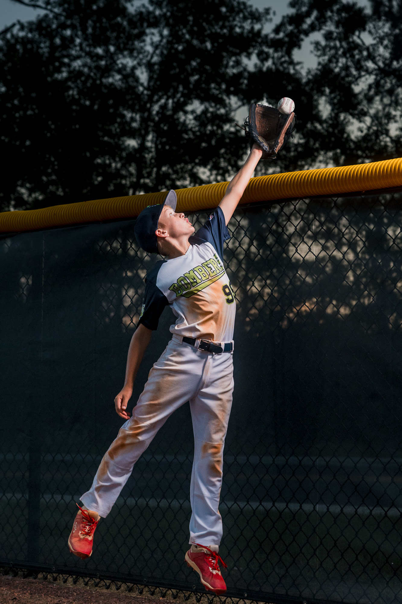 Moody portrait leaning forward into the light.