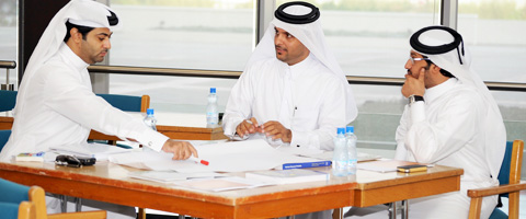 Students studying in a modern library at Qatar University, representing academic excellence and international opportunities.