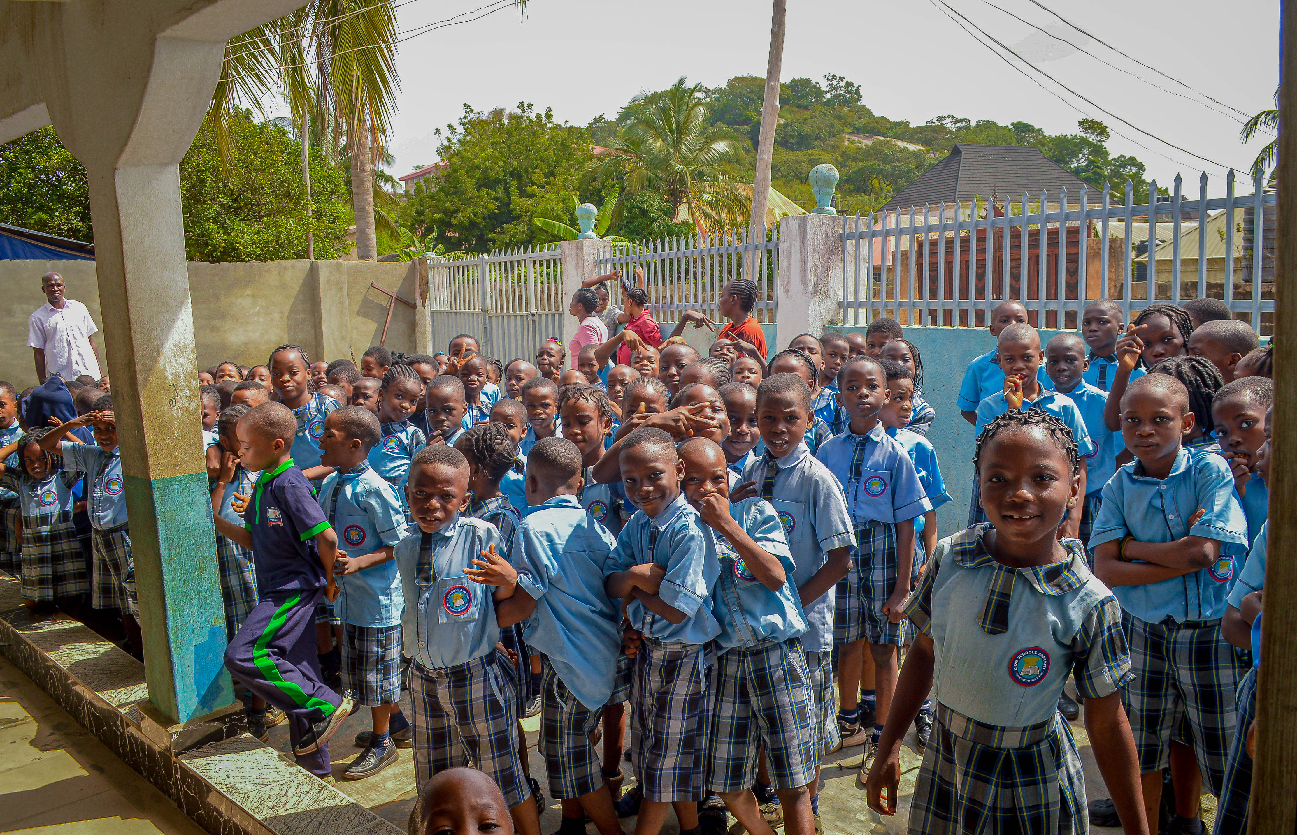 Younger students learning the school pledge