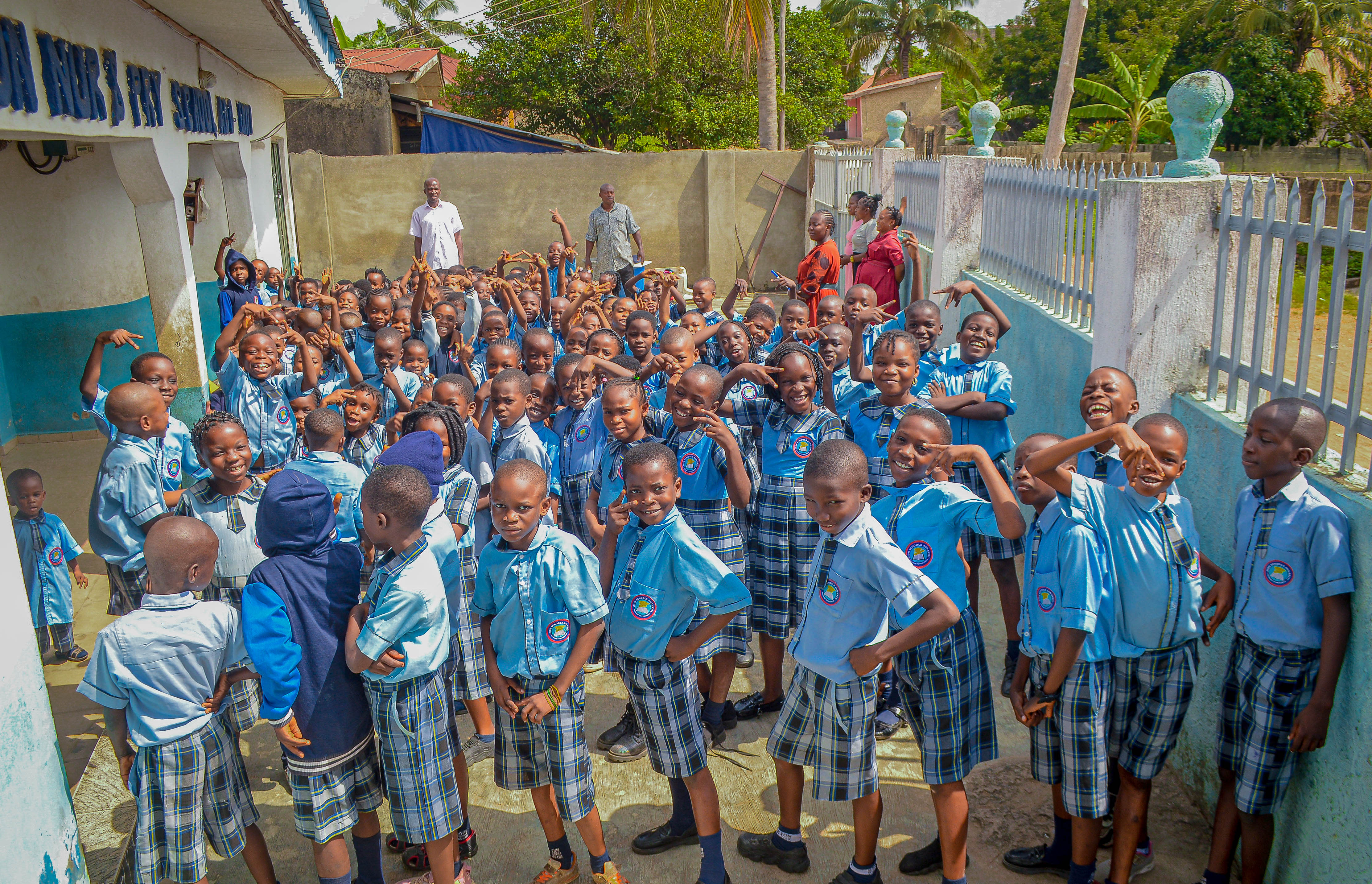 Students singing the school anthem with pride
