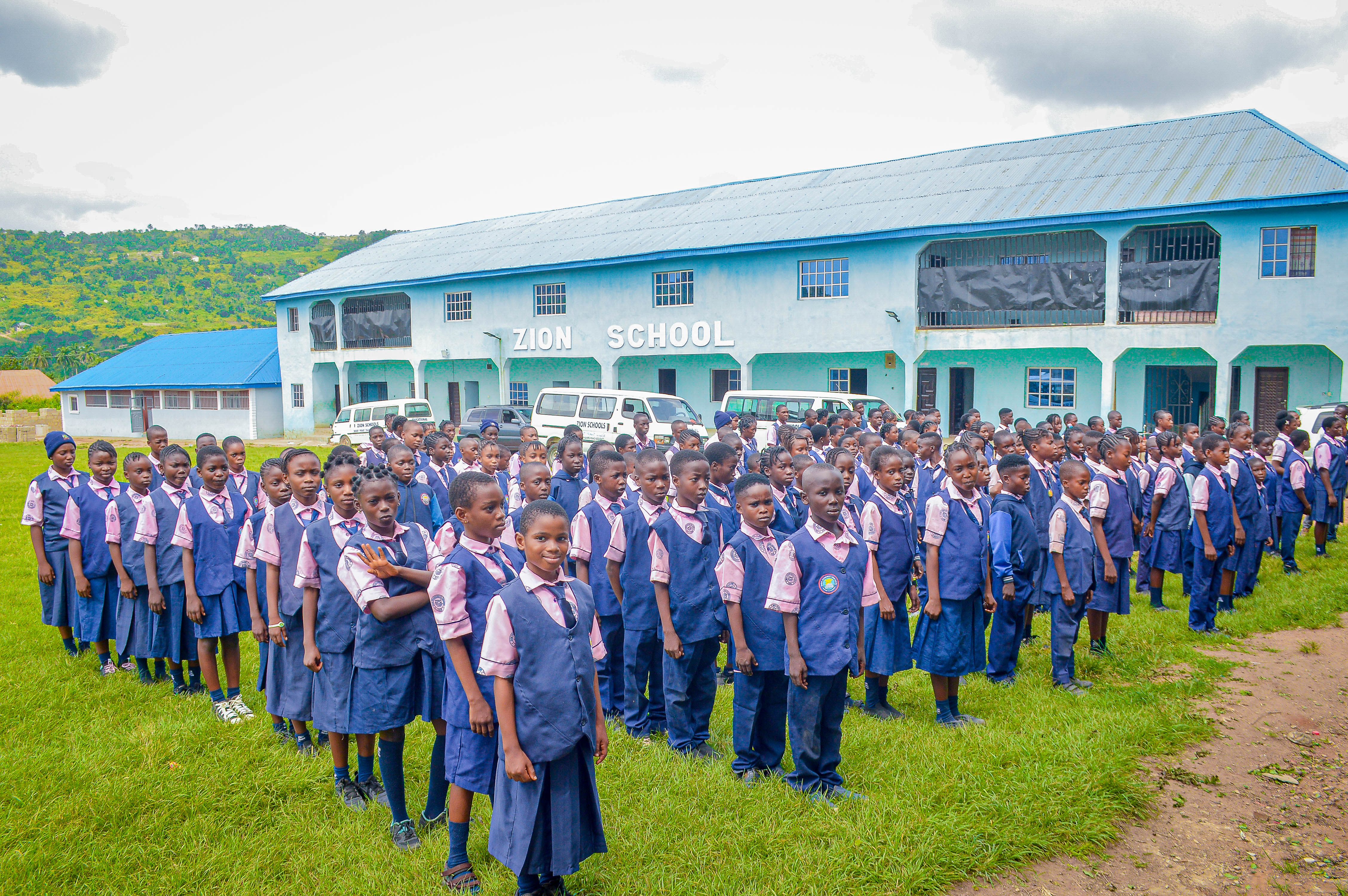 Students reciting the school pledge during morning assembly