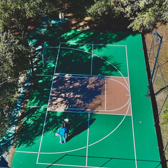 Aerial view of green basketball court