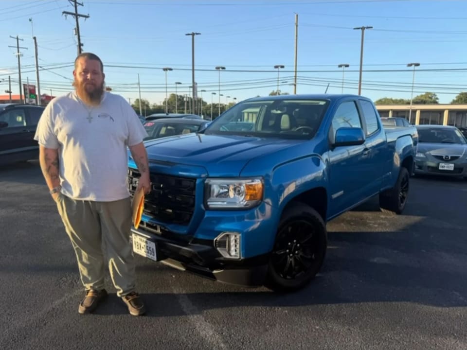 A Key Konnect customer with their new car on the lot in Killeen