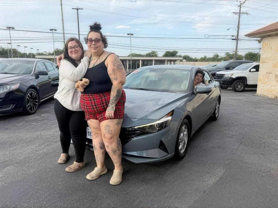 A Key Konnect customer with their new car on the lot in Killeen