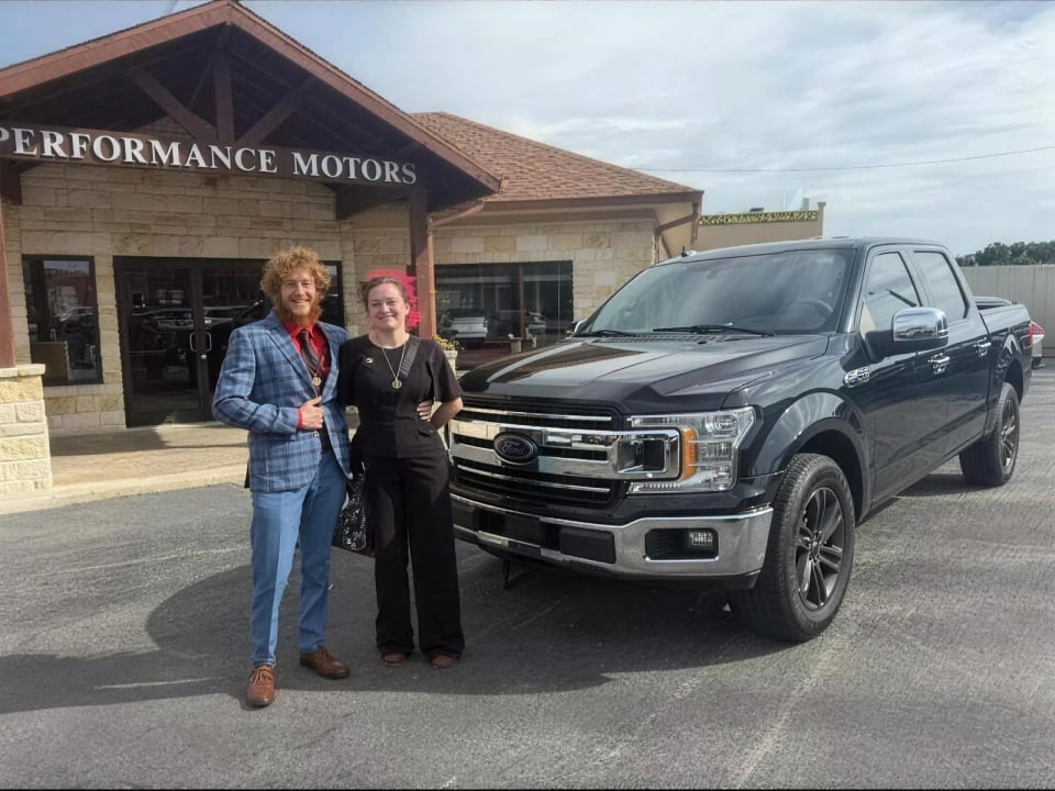 A Key Konnect customer with their new car on the lot in Killeen