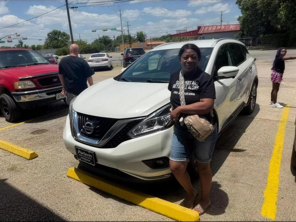 A Key Konnect customer with their new car on the lot in Killeen