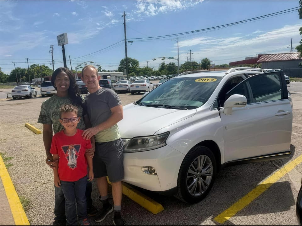 A Key Konnect customer with their new car on the lot in Killeen