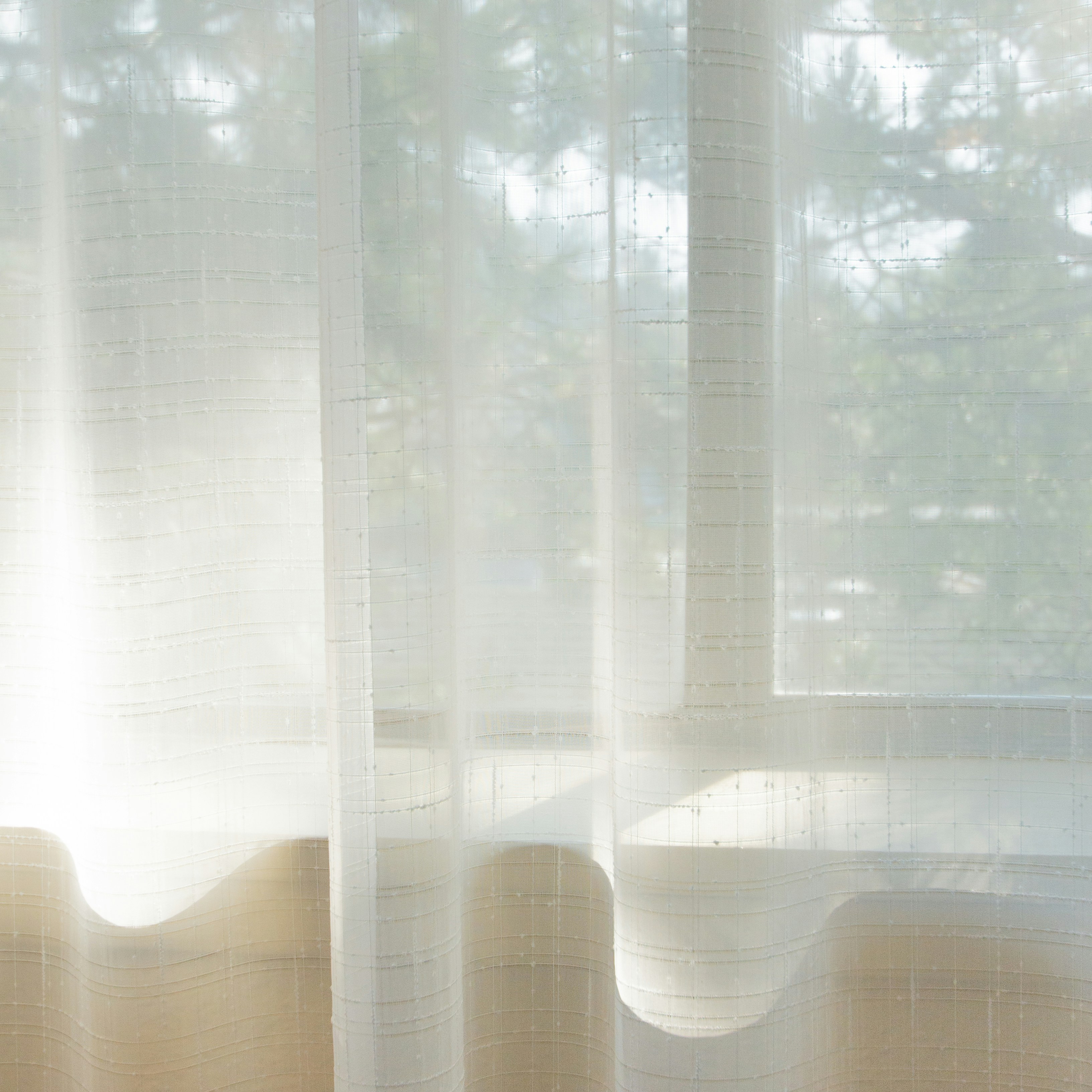Light flowing sunscreen curtains with soft natural light