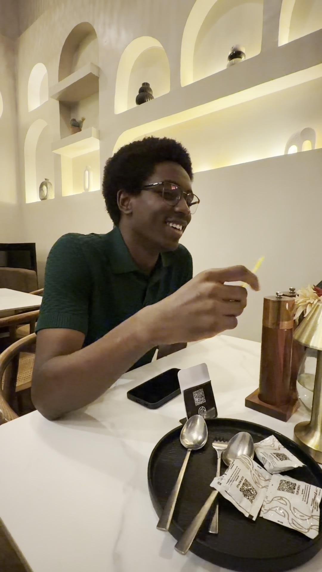 Jeremy laughing at the table at Artisan Blend Kilimani