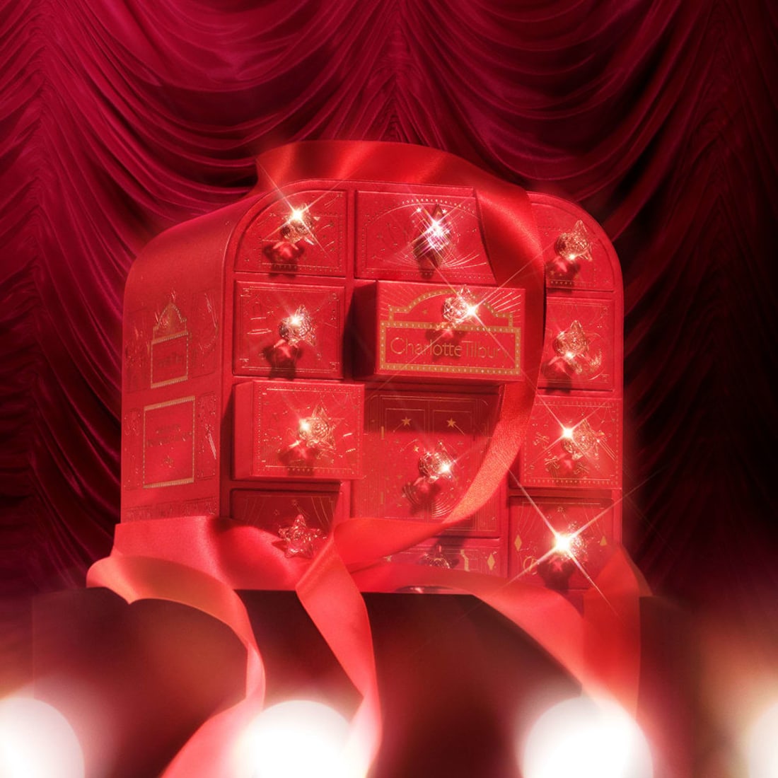 Charlotte Tilbury advent calendar 2026 closed, red and gold box with jewel-handled drawers