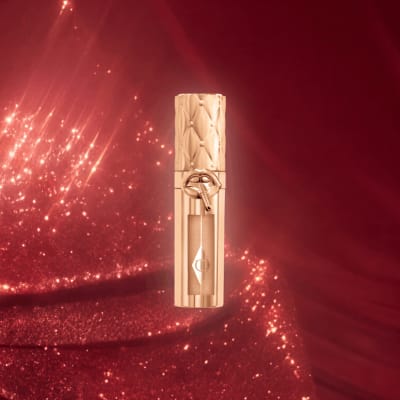 Charlotte Tilbury Big Lip Plumpgasm gloss in Nudegasm Diamonds, travel size, from the 2026 advent calendar