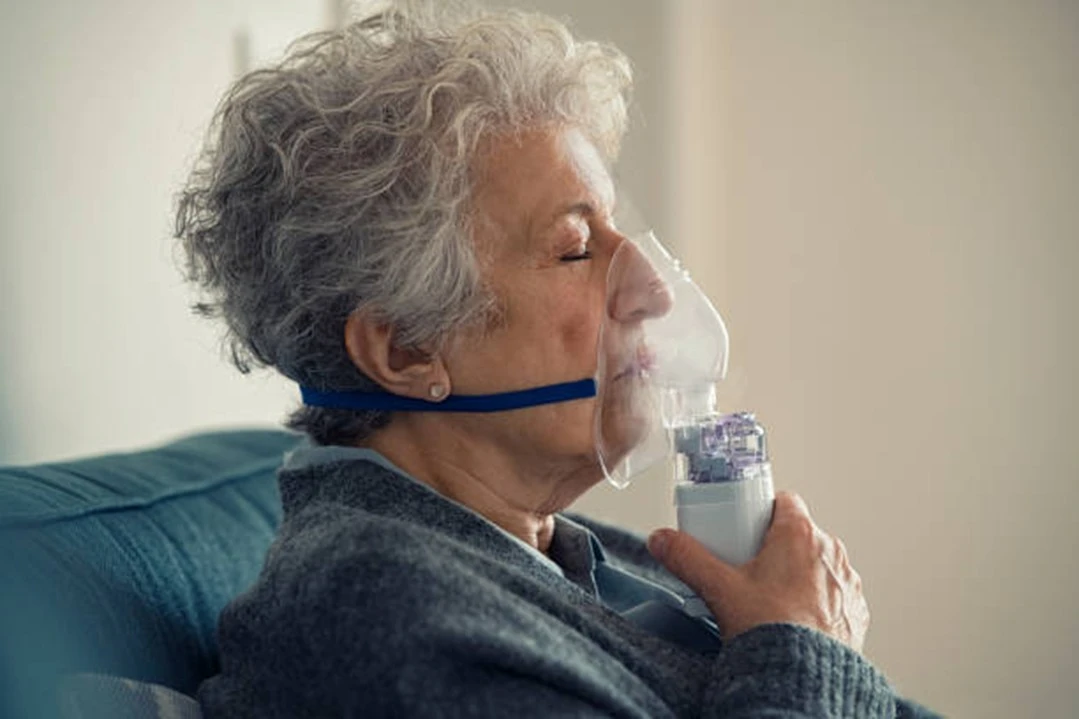 Image of a Woman Using Inhaler for Respiratory Health