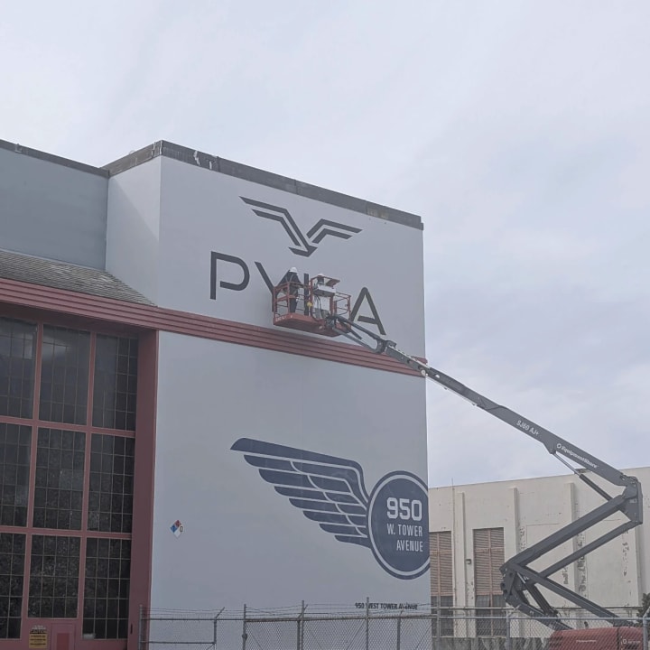 PYKA Building Logo Sign Installation Boom Lift, custom signage project in the San Francisco Bay Area.